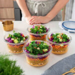 Chickpea, Turmeric Pearl Couscous & Creamy Harissa Salad Meal Prep in Containers
