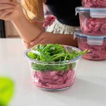 High-protein pink pasta in a container for meal prep