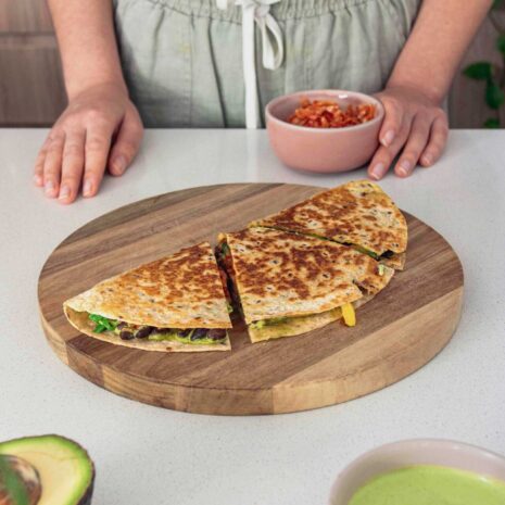 Kimchee quesadilla, cut on a chopping board