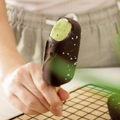 Avocado mint chocolate ice cream with bit taken from it