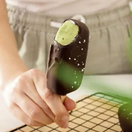 Avocado mint chocolate ice cream with bit taken from it