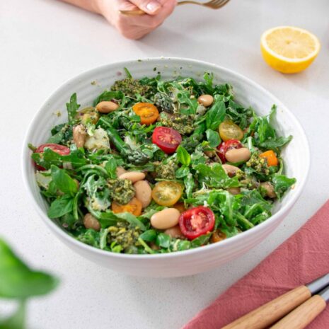 Vibrant salad bowl full of the Butter Bean Pesto Salad