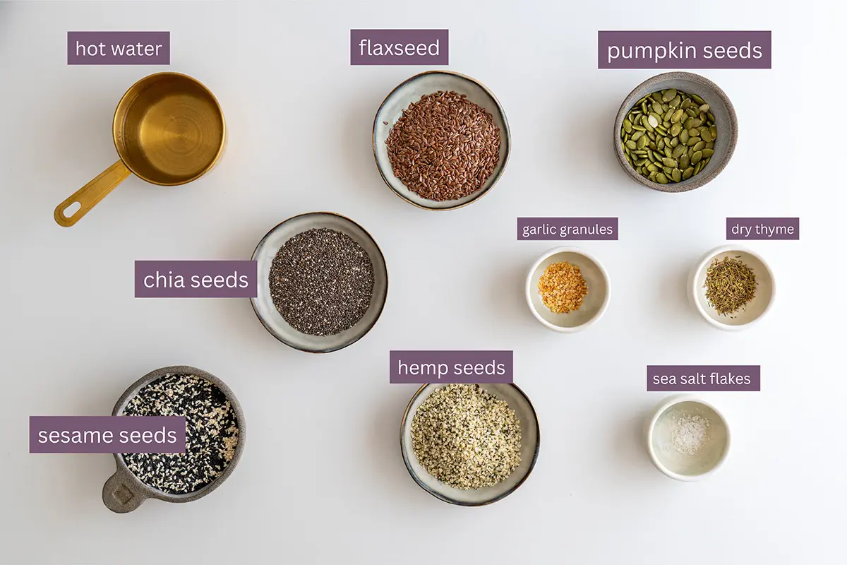 Ingredients for oil-free, flour-free seeded crackers neatly organized with labels.