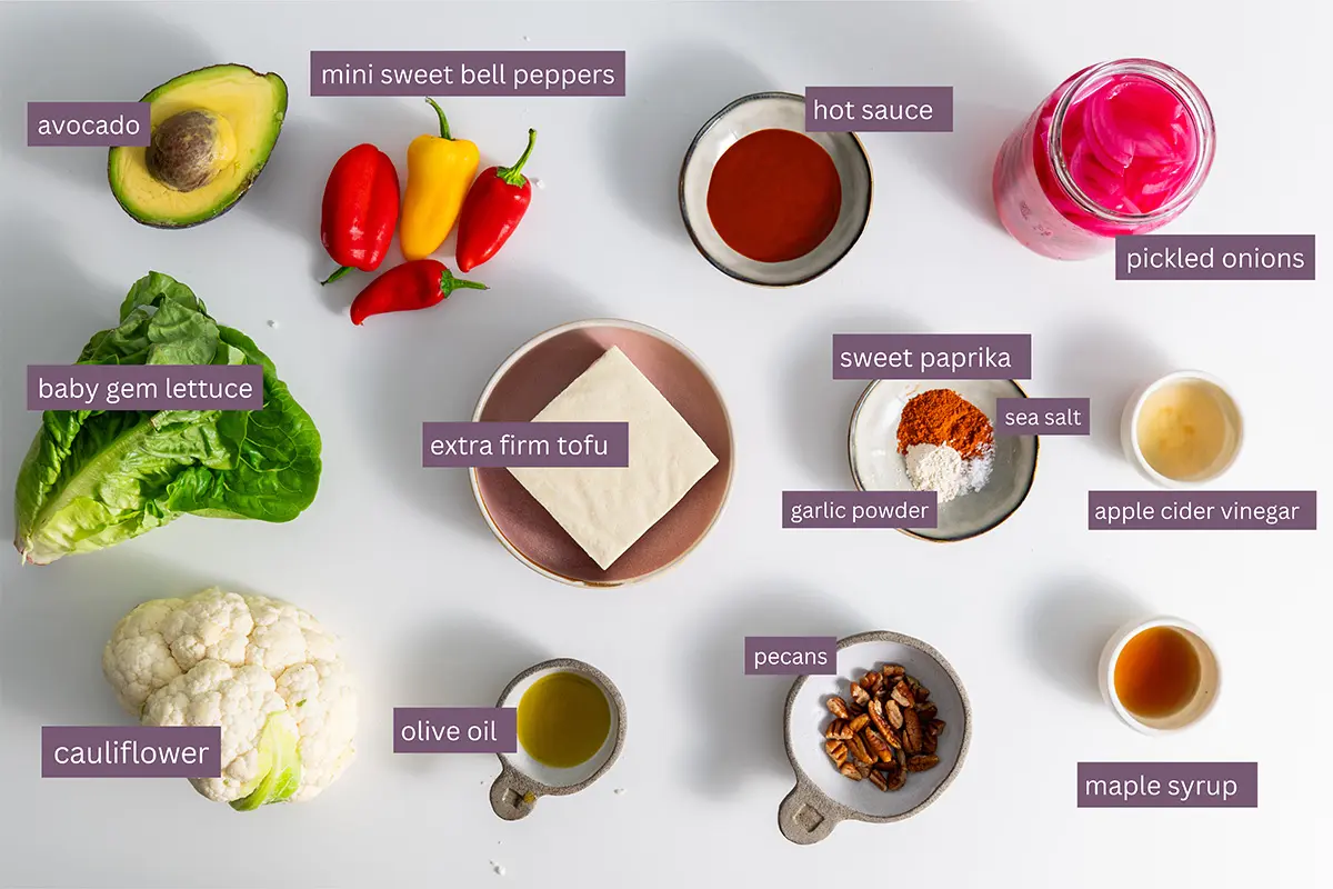 Assorted vibrant ingredients prepped for creating a nutritious buffalo cauliflower salad.