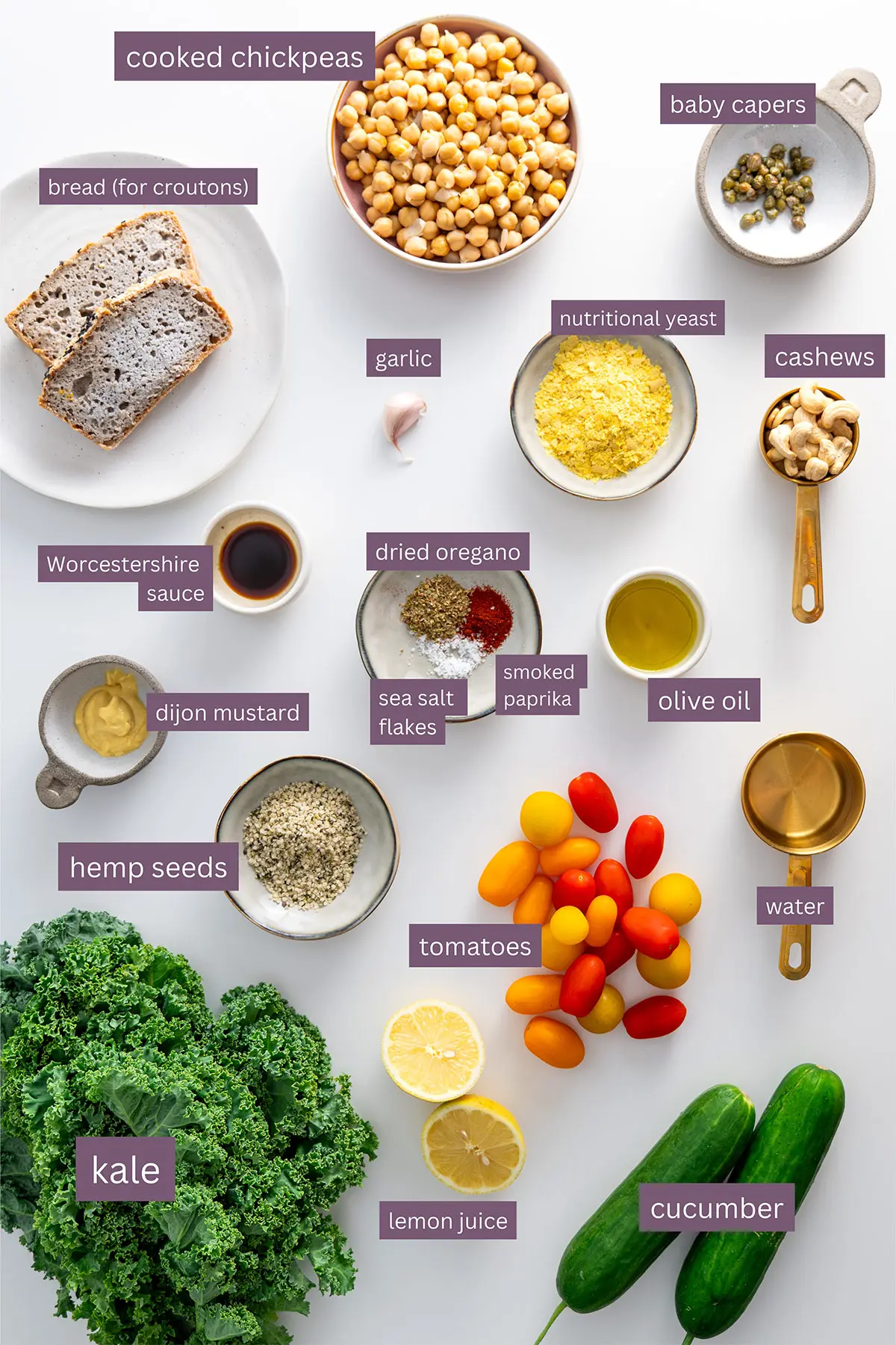 Ingredients for High-Protein Vegan Kale Caesar Salad laid out on a white surface.