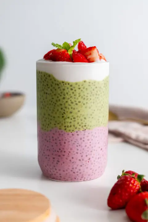 Jar of strawberry matcha chia pudding layered beautifully