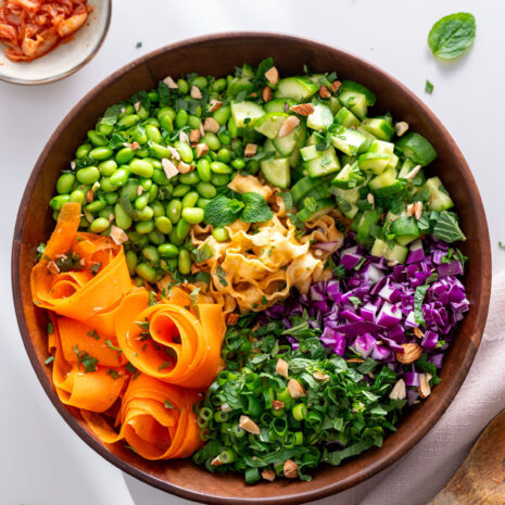 High-protein noodle salad in a bowl with vibrant vegetables.