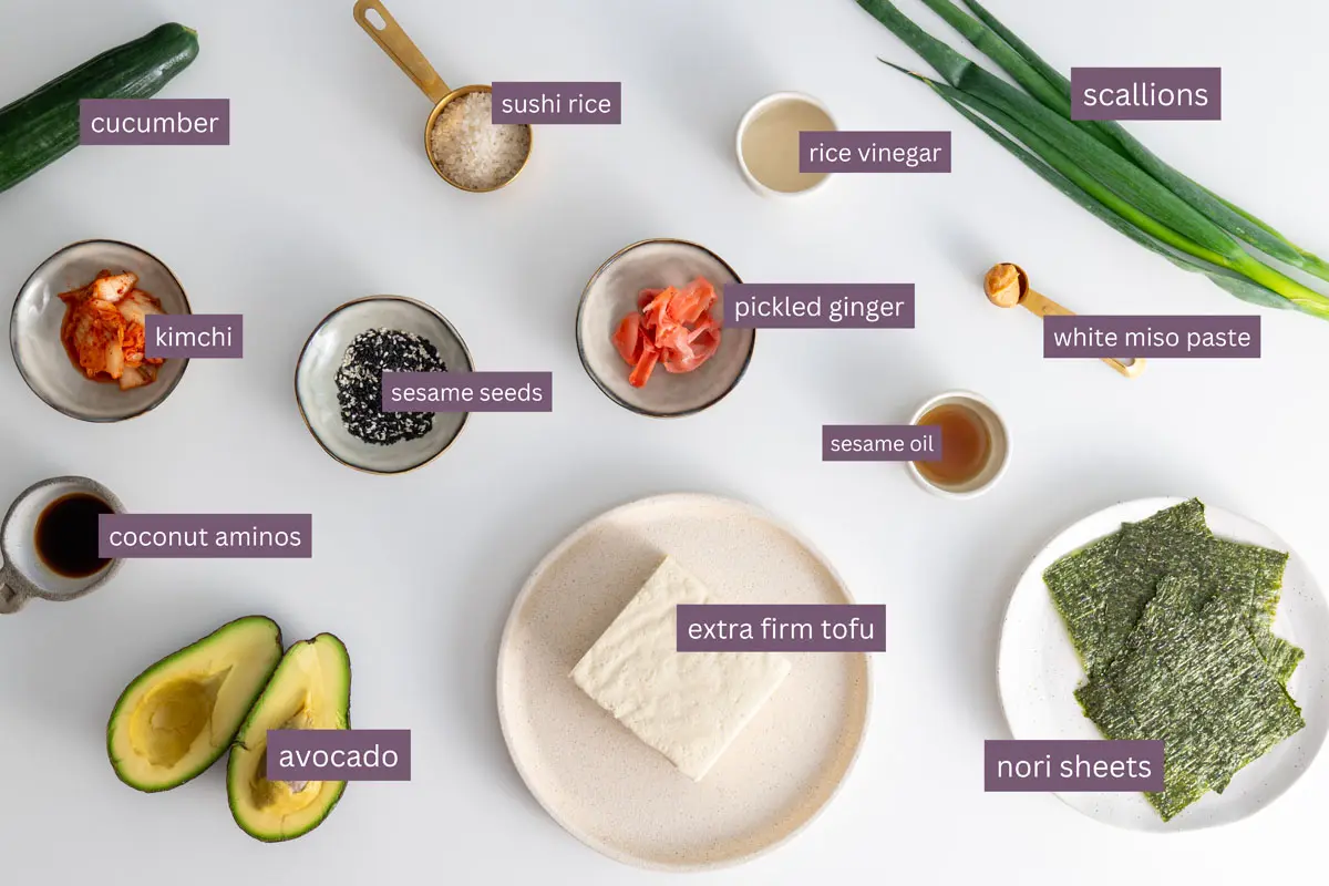 Ingredients for a High-Protein Vegan Sushi Bowl on a white surface, labeled with ingredient names.