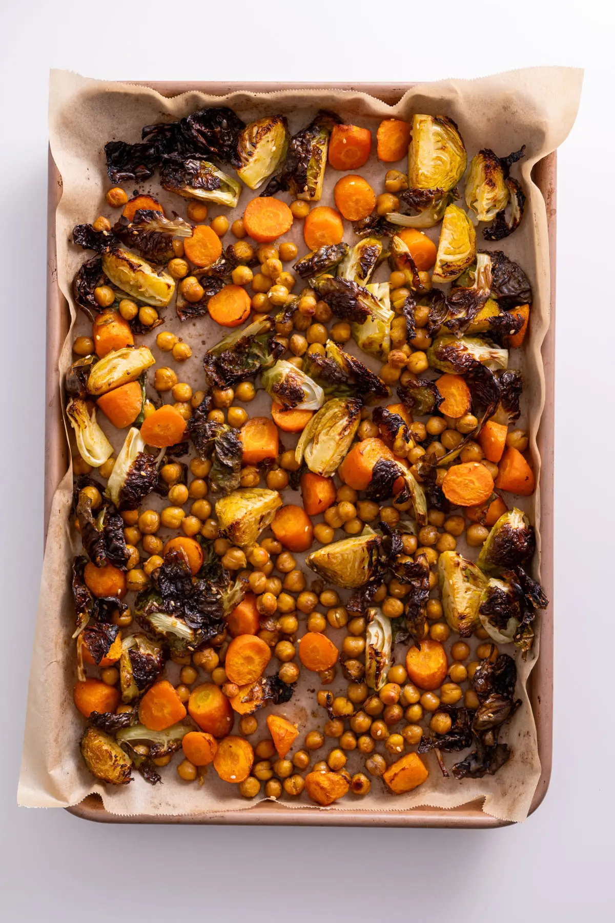 Sweet & Spicy Roasted Veggies on a baking tray after roasting.