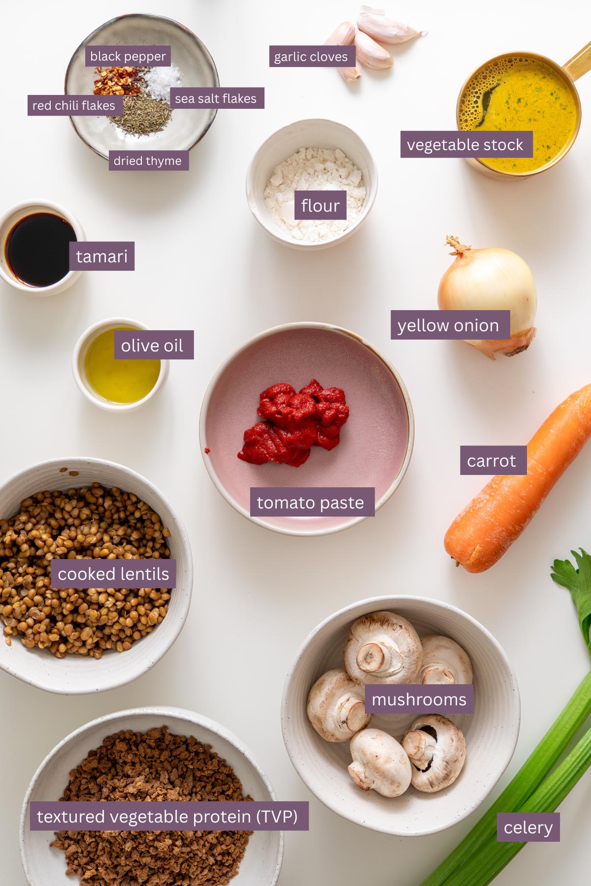vibrant ingredients for a high-protein shepherds pie on a white surface