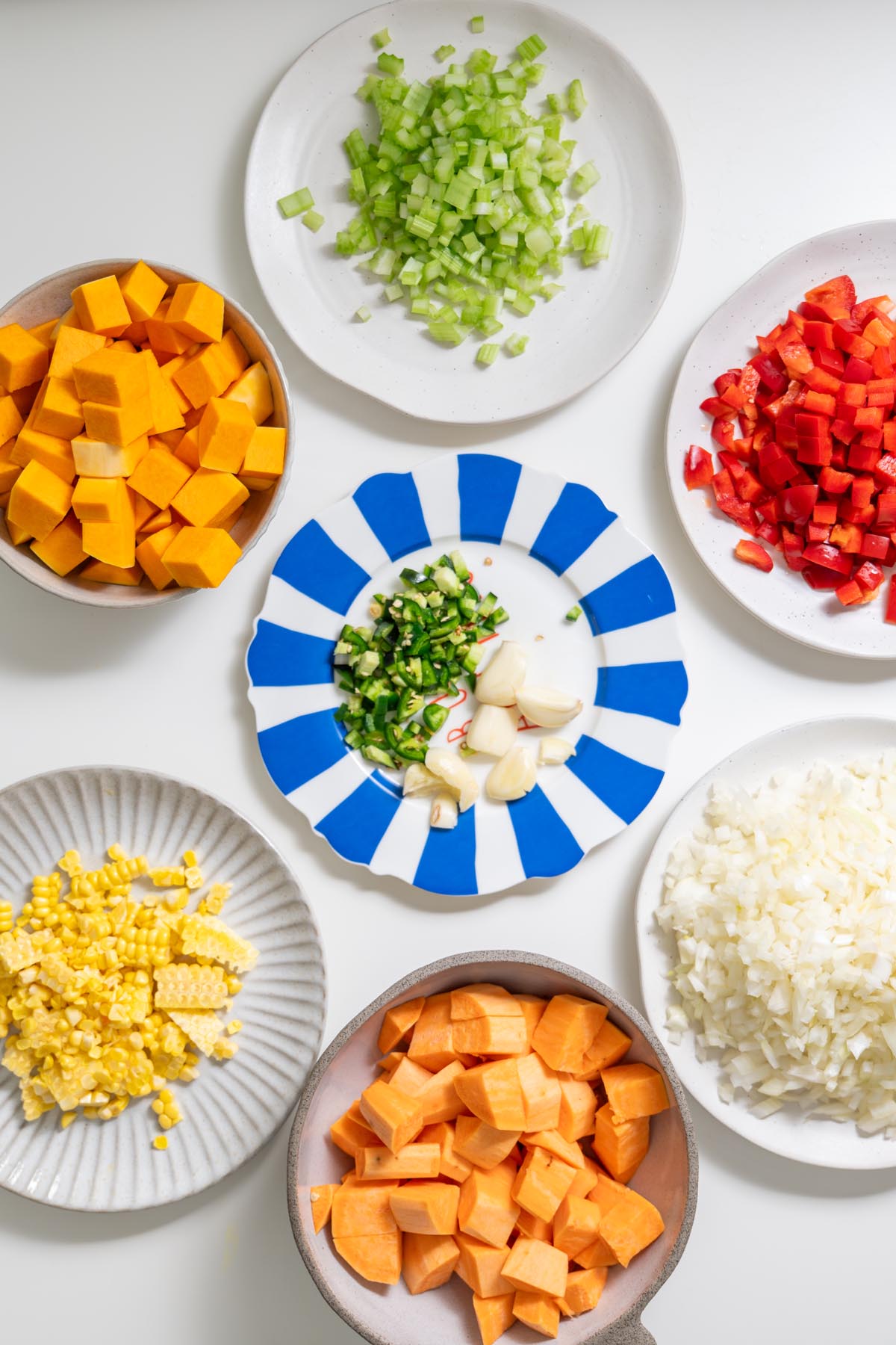Vibrant ingredients for a Tex Mex Shepherd’s Pie on a white surface