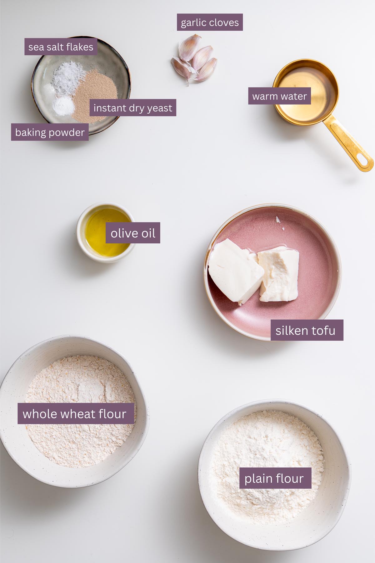 Vibrant ingredients for an easy dairy-free naan recipe on a white surface