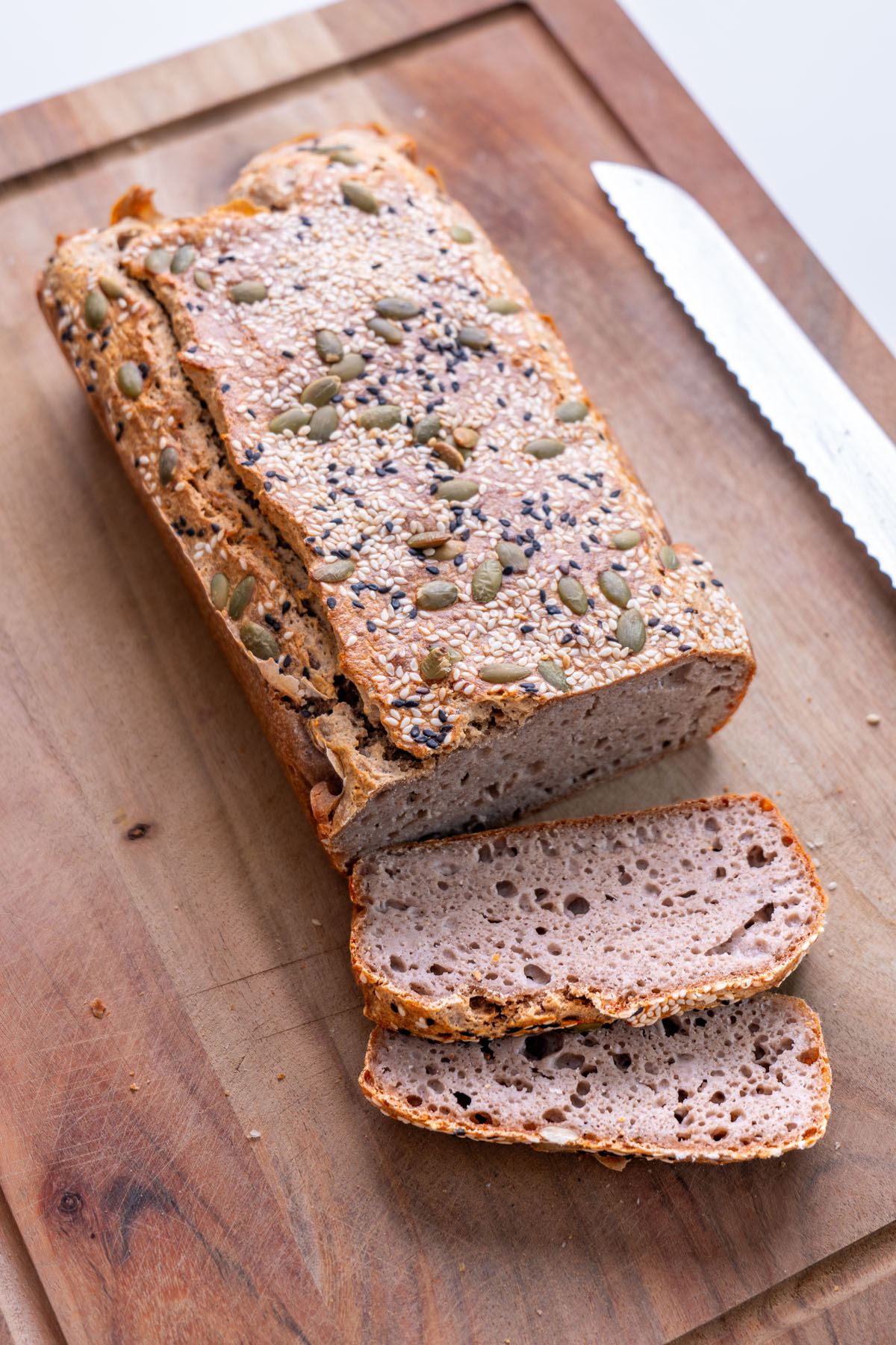 Freshly sliced buckwheat bread on a wooden chopping board