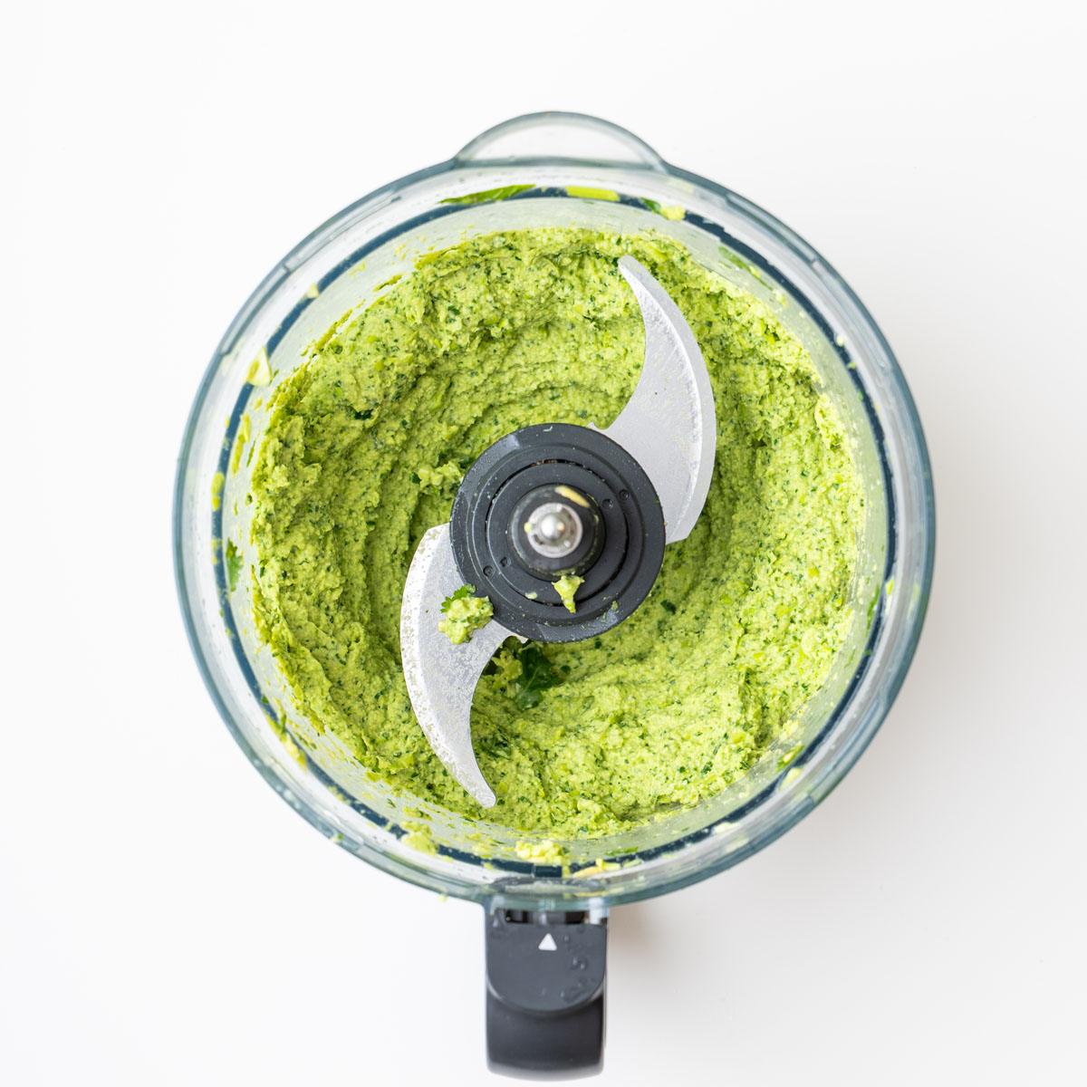 Creamy green edamame avocado spread freshly blended in a food processor