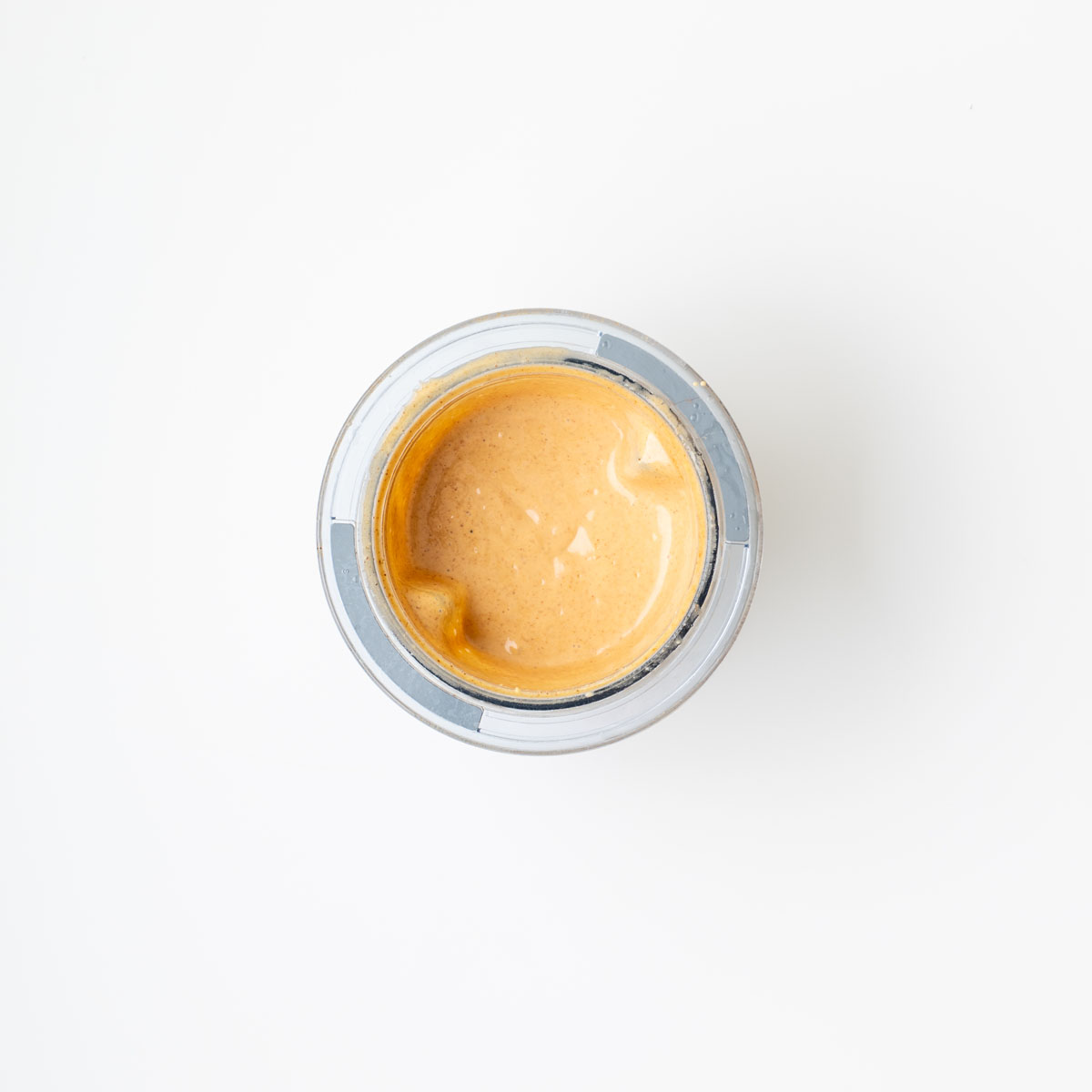 Vibrant ingredients for turmeric quinoa and edamame salad with almond satay dressing on a surface