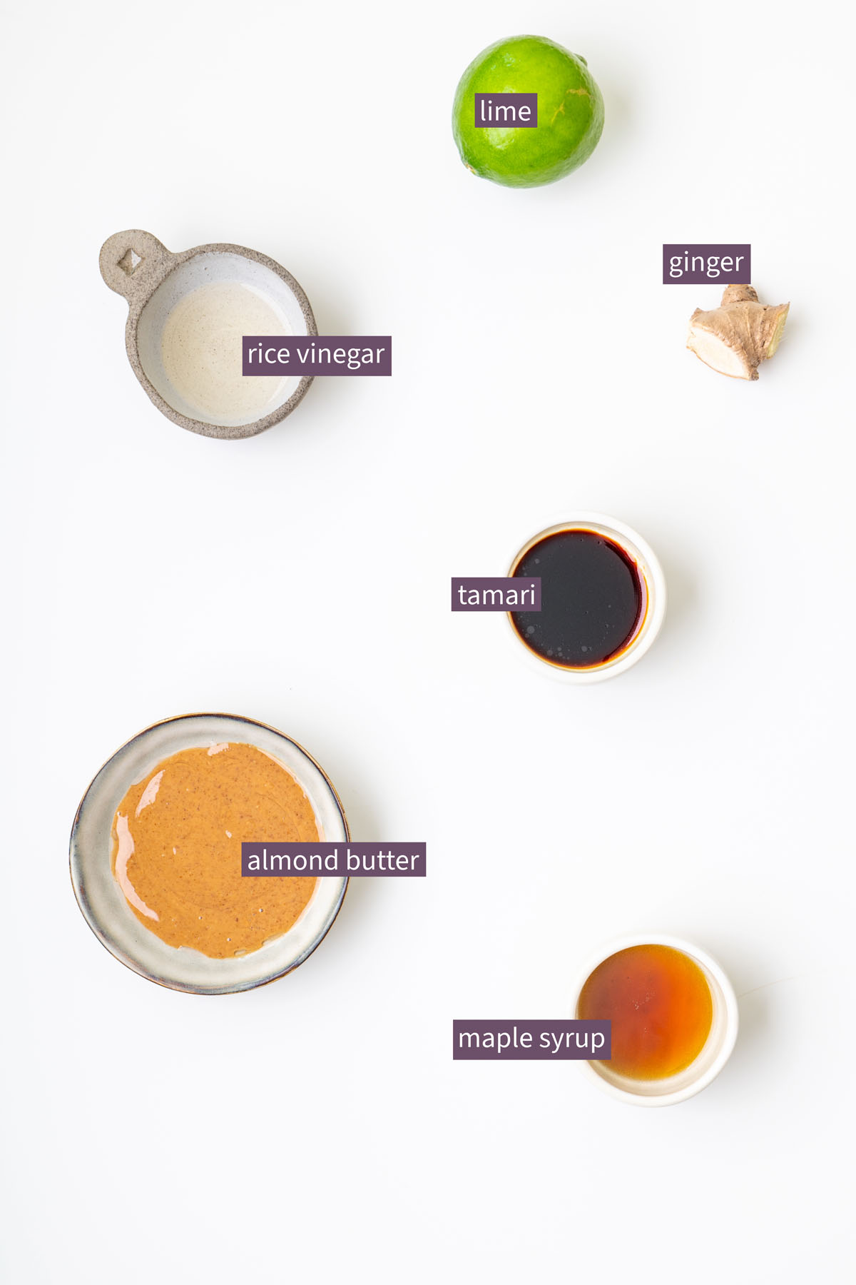 Golden turmeric quinoa salad with shredded red cabbage, edamame, and fresh mint leaves