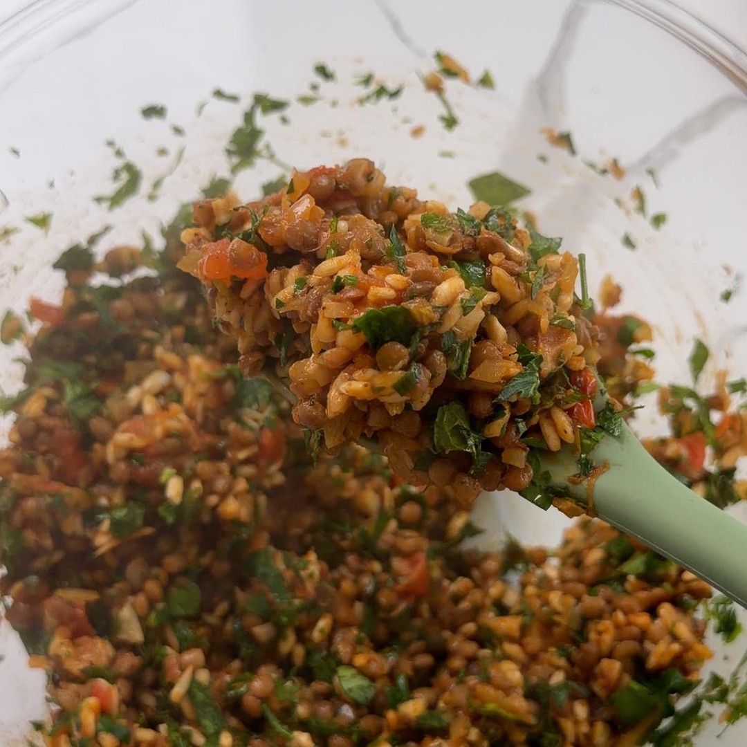 stirring chopped parsley and mint through the lentil and rice filling.