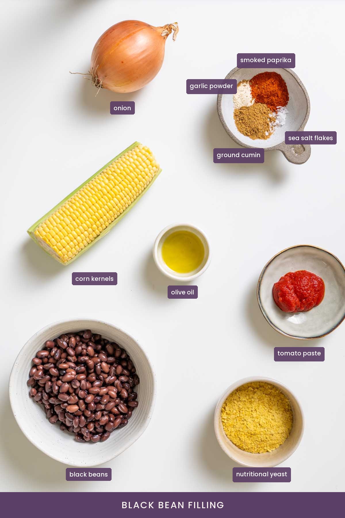 vibrant ingredients for the black bean filling of Mexican sweet potato hot pockets on a white surface.