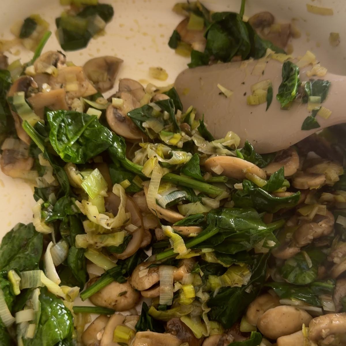 baby spinach wilted through the cooked mushroom and leek filling.